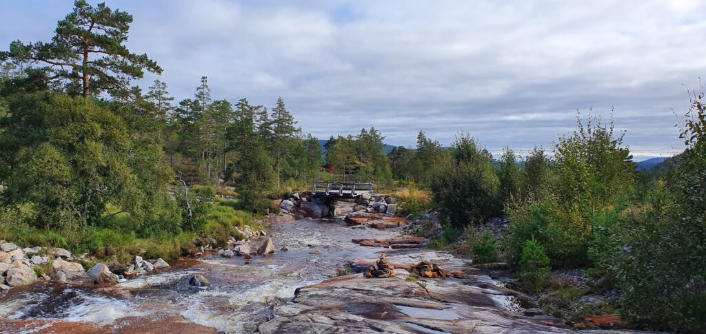 Crossing a mountain stream on the easy hike to Himmelriket trail