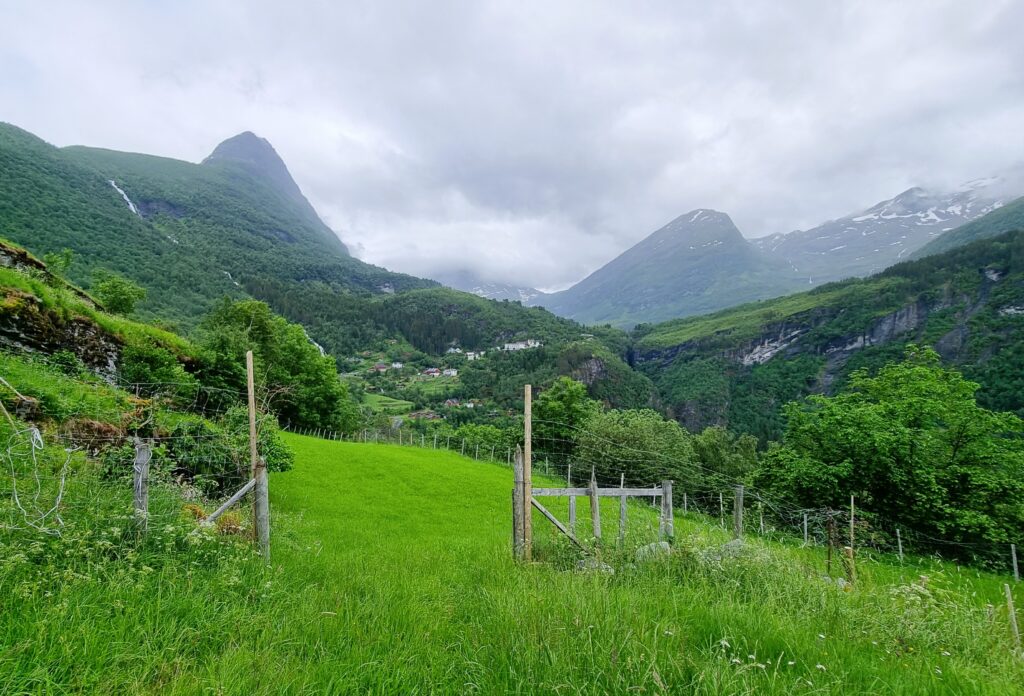 Mountain ridges framing the trail – Geiranger is surrounded by peaks.