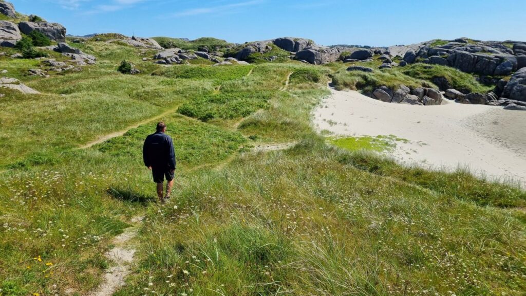 Hiking path along the Ogna coastal walk with views of Norway's hidden beaches