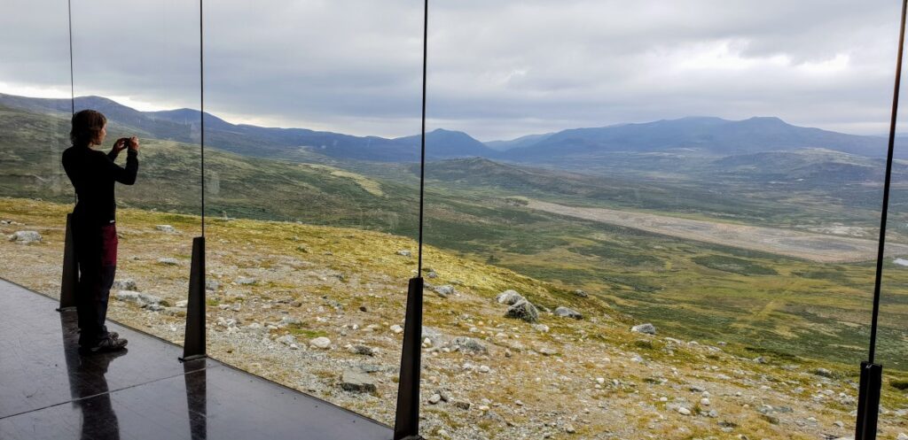 Inside the Snøhetta Viewpoint pavilion – panoramic windows showcasing Dovrefjell’s mountains