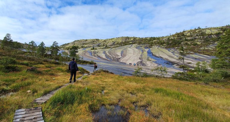 Arriving the rock amphitheater - boardwalk across marshland on the easy hike to Himmelriket Norway