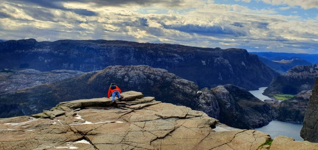 Wide flat top of Pulpit Rock with people enjoying the view after the hike